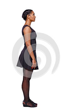Side view of an African-American woman in a brown dress.