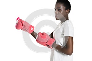 side view of african american woman in pink boxing gloves looking at camera