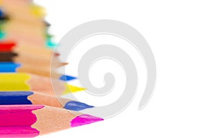 Side view of aligned coloring crayons isolated