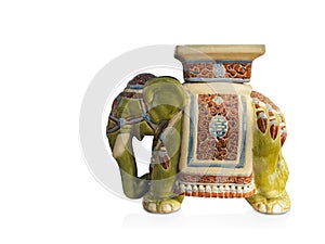 Side view antique green and cream elephant ceramic standing on white background, vintage, object, animal, decor, copy space