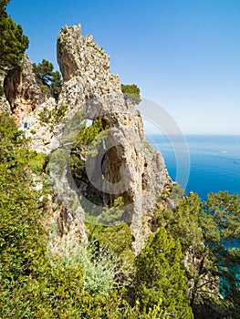 Side view of Arco Naturale, natural arch on coast of Capri island, Italy photo