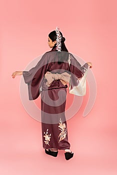 Side view of asian woman posing