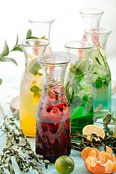 Side view on assorted fresh fruit lemonades