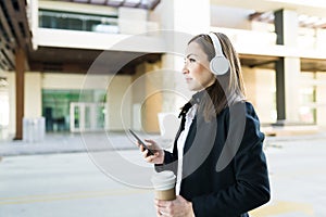 Side view of an attractive business woman walking to her work