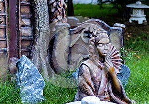 Side view of an avalokitesvara statue a woman who has attained bodhisattva. Japanese mythology and Buddhism concept