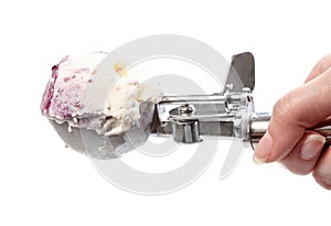 side view of ball of ice cream in disher scoop