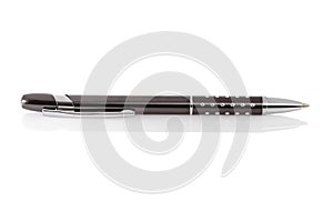 Side view of a ballpoint pen, isolated on a white background. Close-up