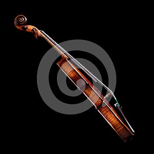 Side view of a baroque violin on black