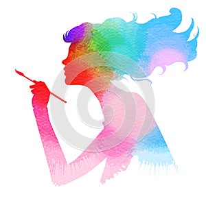 Side view of beautiful artist girl holding paint brush