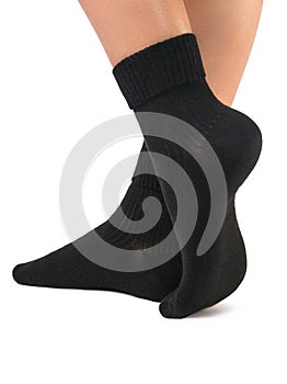Side view of beautiful woman foot dressed in new nice and soft natural cotton fabric blank black socks