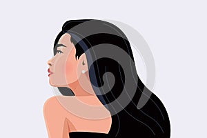 Side view. Beautiful young woman with superb black hair. Portrait of a young girl for a poster, stock, flyer or postcard