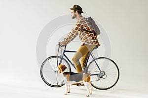 side view of bicycler with dog