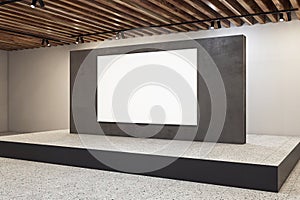 Side view of black blank wall with white poster on large podium and concrete floor on beige wall background in spacious modern