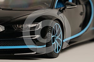 Side view of black Bugatti Chiron with blue trim toy car photo