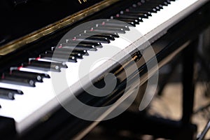 side view of black and white piano keyboard