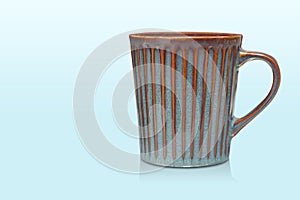 side view blue and brown ceramic cup on blue background, object, decor, fashion, decoration, kitchen, antique, copy space