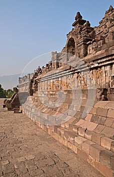 Side View of Borobudur at the base with plenty of small stupas and buddha statues