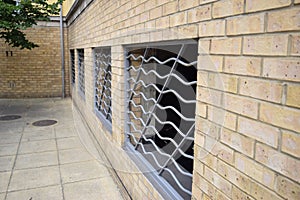 Side view of a brick wall with sliver bars