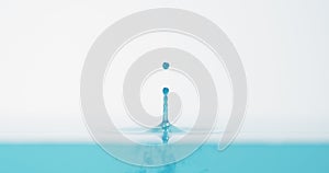 Side view of bright blue water drop with accurate splash