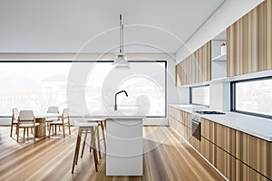 Side view on bright kitchen room interior with panoramic window