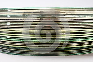 Side view of a bunch of old compact discs