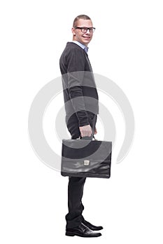 Side view of a business man holding a briefcase and looking away