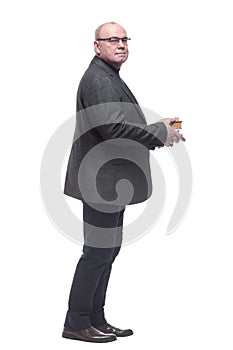 side view. a business man with a stack of books looking ahead