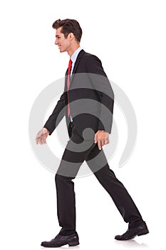Side view of a business walking forward