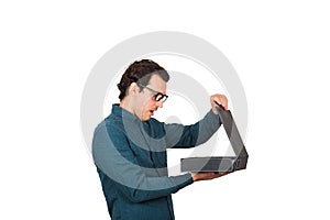 Side view businessman looking inside a briefcase, surprised facial expression,  on white background. Shocked and