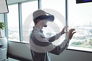 Side view of businessman using virtual reality glasses