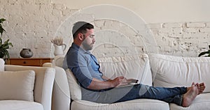 Side view businessman work at quarantine at home use laptop