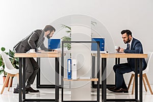 side view of businessmen working and drinking coffee