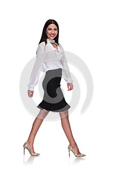 Side view of businesswoman in black skirt stepping