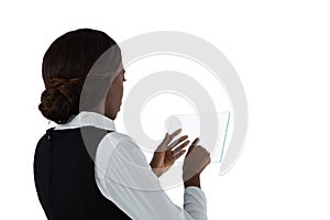 Side view of businesswoman with brown hair using glass interface