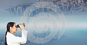 Side view of businesswoman looking at upside down city through binoculars