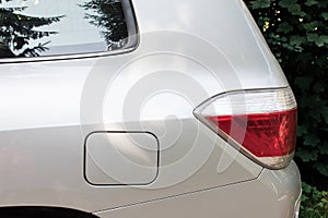 Side view of a car parked on the street with fuel opening. Mock-up for sticker or decals