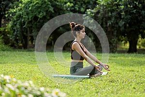 Side View Of Charming Model Sitting In Lotus Position