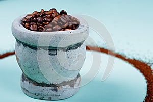 Side view of Coffee on stone Mortar photo