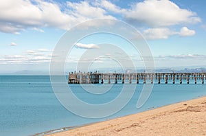 Side view of concrete jetty into the sea on sky