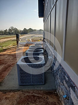 Side view of condensers outside commercial building