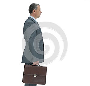 Side view.confident businessman with briefcase.