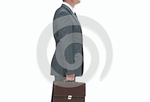 Side view.confident businessman with briefcase.