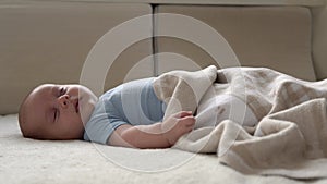 Side View Cute Kid 2 Month Newborn Boy Sweetly Sleeping After Bath Shower On White Soft Bed. Baby Child Napping Time