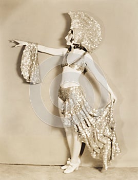 Side view of dancer posing in sparkly costume