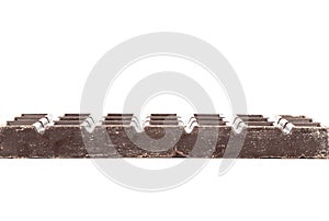 Side view of a dark chocolate bar on a white background.