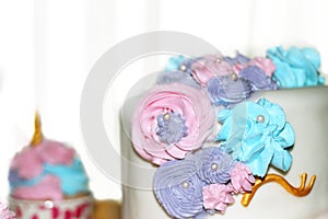 Side view of decorated creamy cake on blur cupcake background