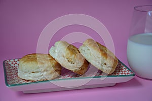 Side view of delicious breads with milk