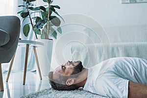 side view of depressive bearded man