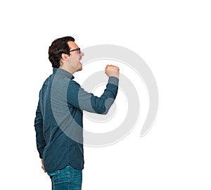Side view of determined businessman shouting and screaming, as holding an invisible imaginary megaphone or microphone isolated on