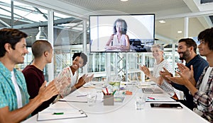 Business people attending video conference at conference room in a modern office